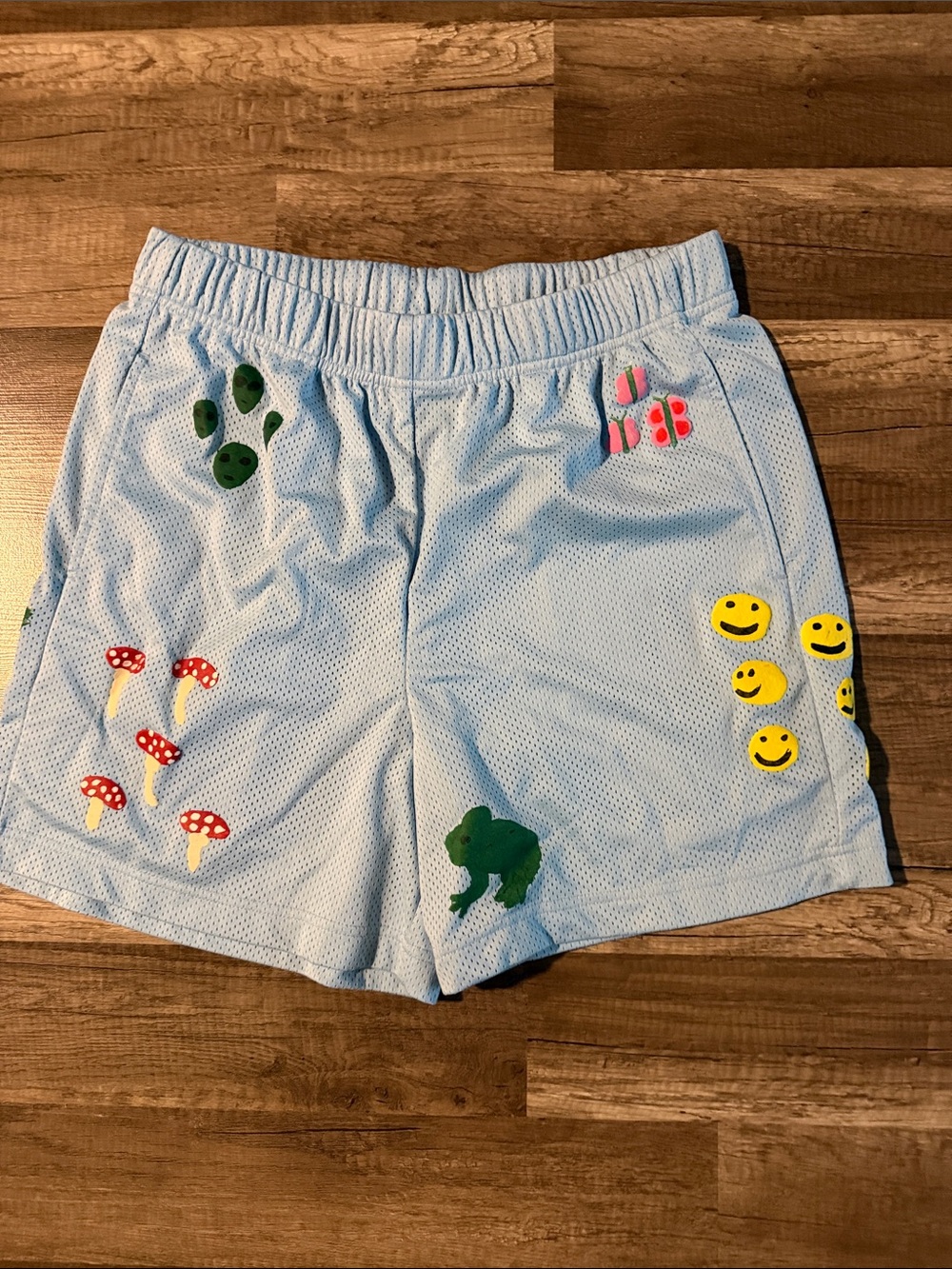 Light Blue Athletic Mesh Shorts with Playful Patch Accents